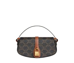 Buy Celine Clutch On Strap Tabou In Triomphe Canvas And Calfskin With Gold Finishing Tan at Sasom – Authentic and Ready to Ship