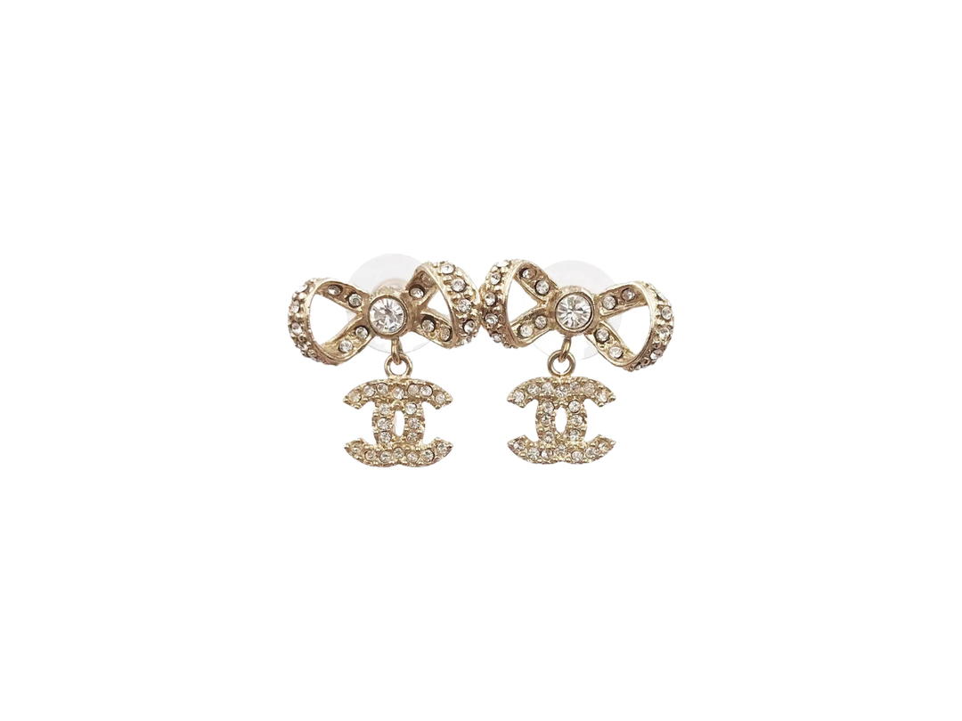 Chanel Chanel Ribbon Bow CC Piercing Earrings In Light Gold Metal With Crystal