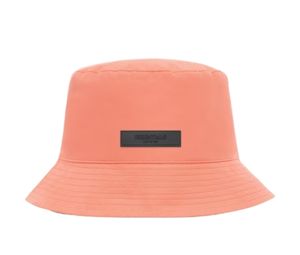Buy Fear of God Essentials Bucket Hat Coral (FW22) at Sasom – Authentic and Ready to Ship