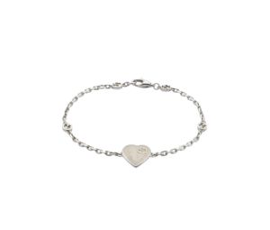 Buy Gucci Heart Bracelet With Interlocking G In Sterling Silver With Mother Of Pearl Effect Enamel at Sasom – Authentic and Ready to Ship