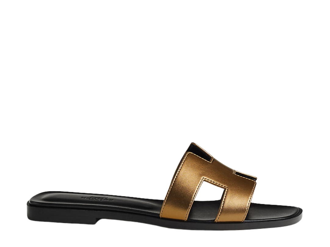 Hermes Hermes Oran Sandal In Calfskin With Metallic Finish And Iconic H Cut-Out Dore Fonce
