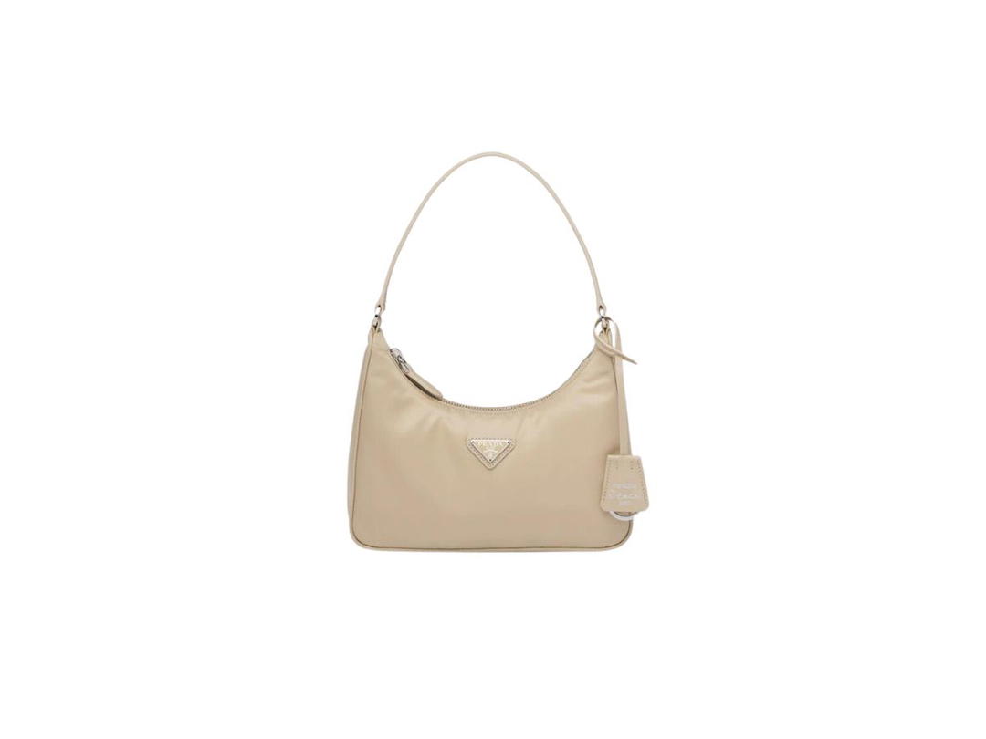 Prada Prada Re-Edition 2005 Re-Nylon Mini Bag With Leather Handle And Enameled Metal Triangle Logo Desert Beige