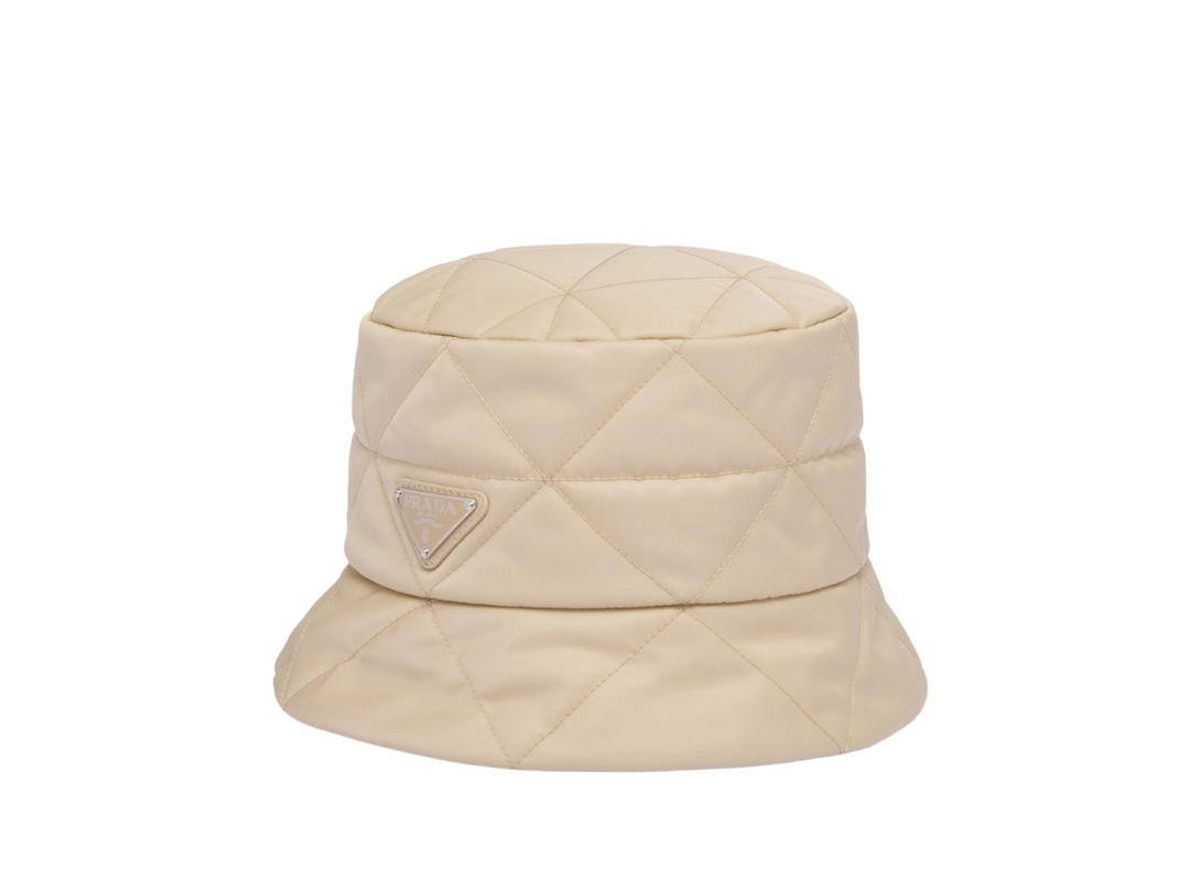Prada Prada Re-Nylon Bucket Hat In Quilted Triangle Motif With Enameled Metal Triangle Logo Desert Beige