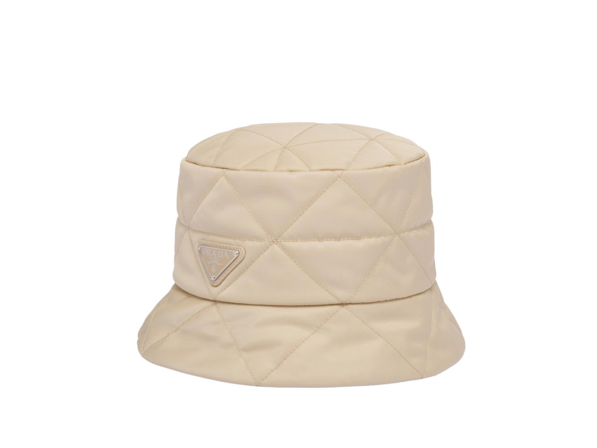 Prada Prada Re-Nylon Bucket Hat In Quilted Triangle Motif With Enameled Metal Triangle Logo Desert Beige