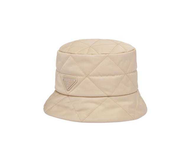Prada Prada Re-Nylon Bucket Hat In Quilted Triangle Motif With Enameled Metal Triangle Logo Desert Beige - view 1